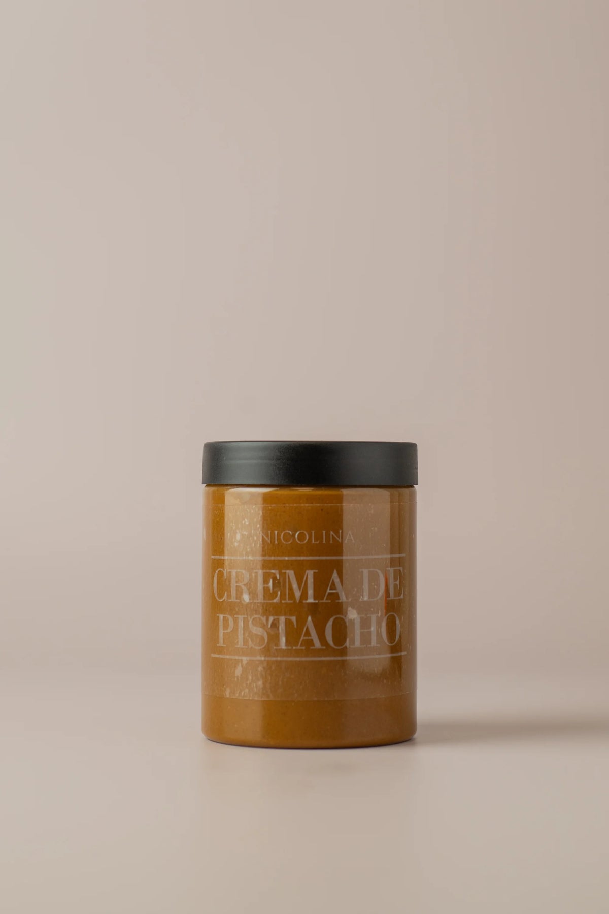 Bote de crema de pistacho Nicolina sin gluten y sin azúcar con textura cremosa y sabor natural a fruto seco.
